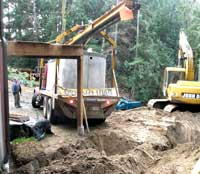 Truck backing up our driveway, toward the post supporting the deck beams